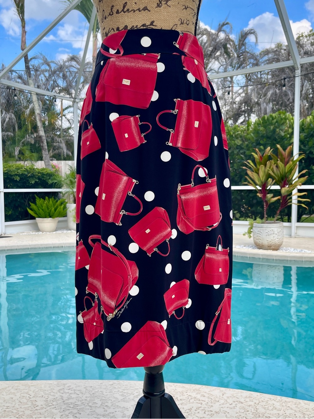 Dolce & Gabbana Black Midi Skirt with Red Handbag and White Polka Dot Print